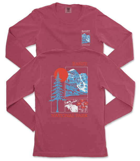 a red long-sleeved t-shirt with a graphic design depicting a mountain landscape, including a sun, pine trees, and a moose.